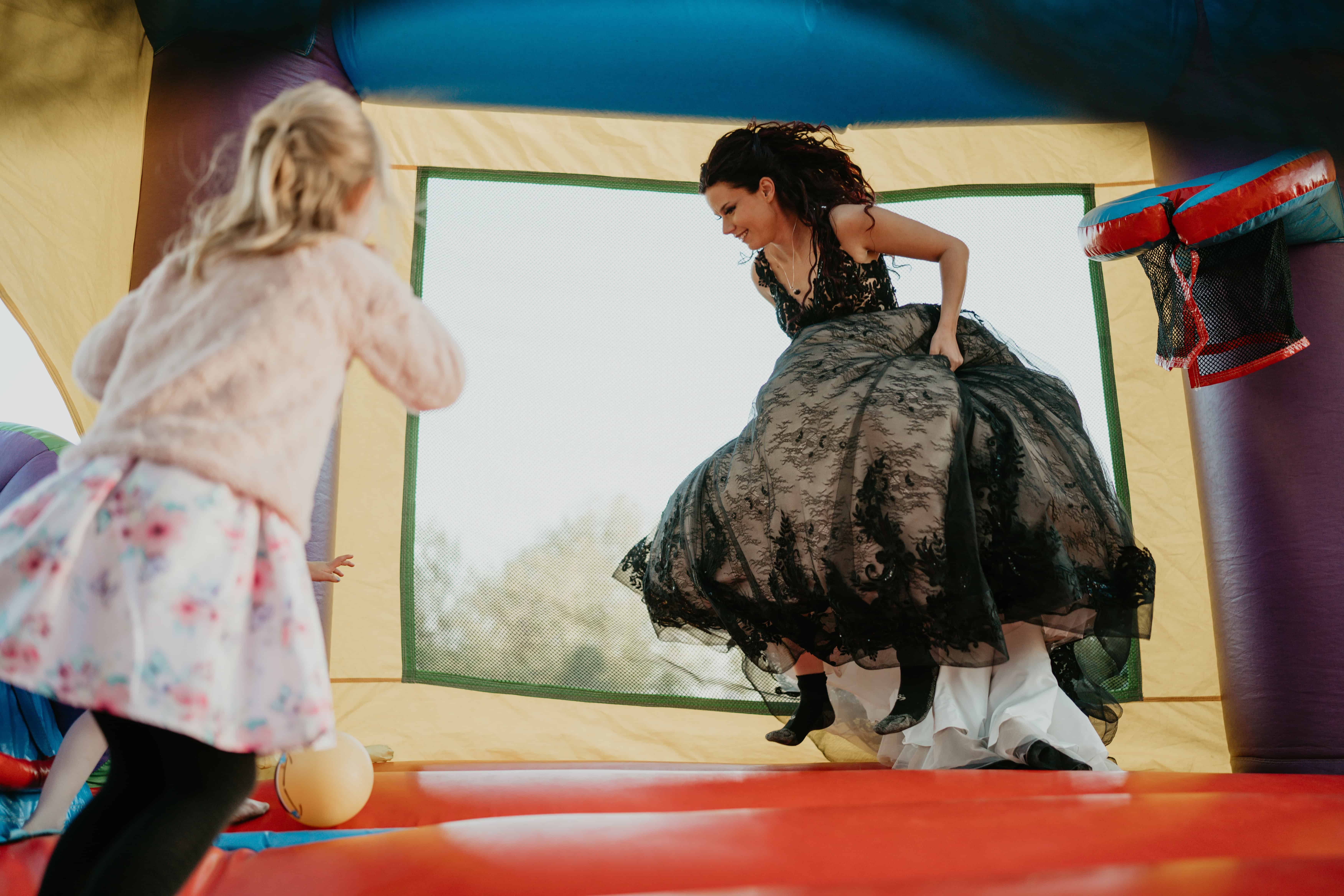 bride on bouncy castle - documentary wedding photography