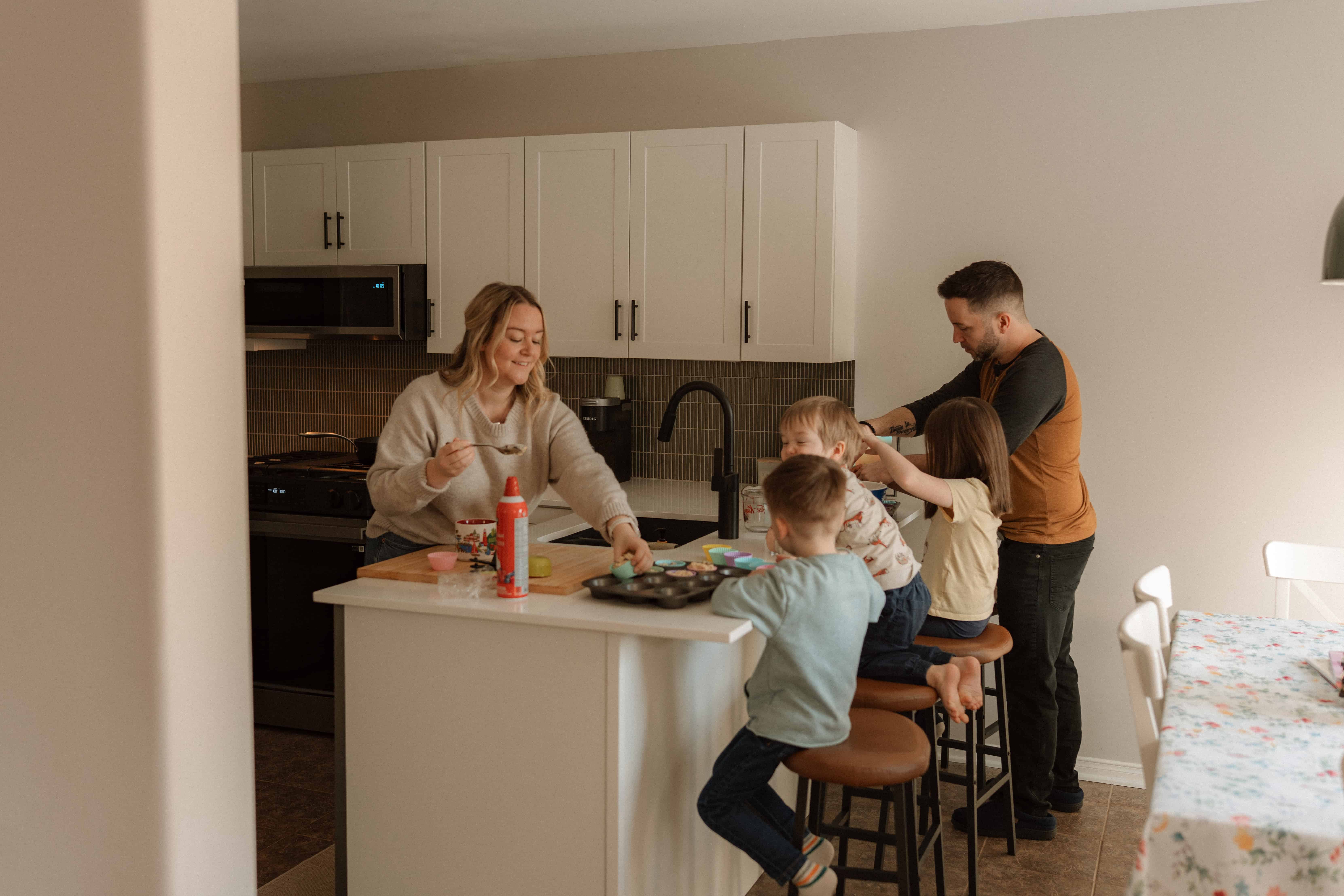 storytelling photography shoot of a family baking muffins in the kitchen together
